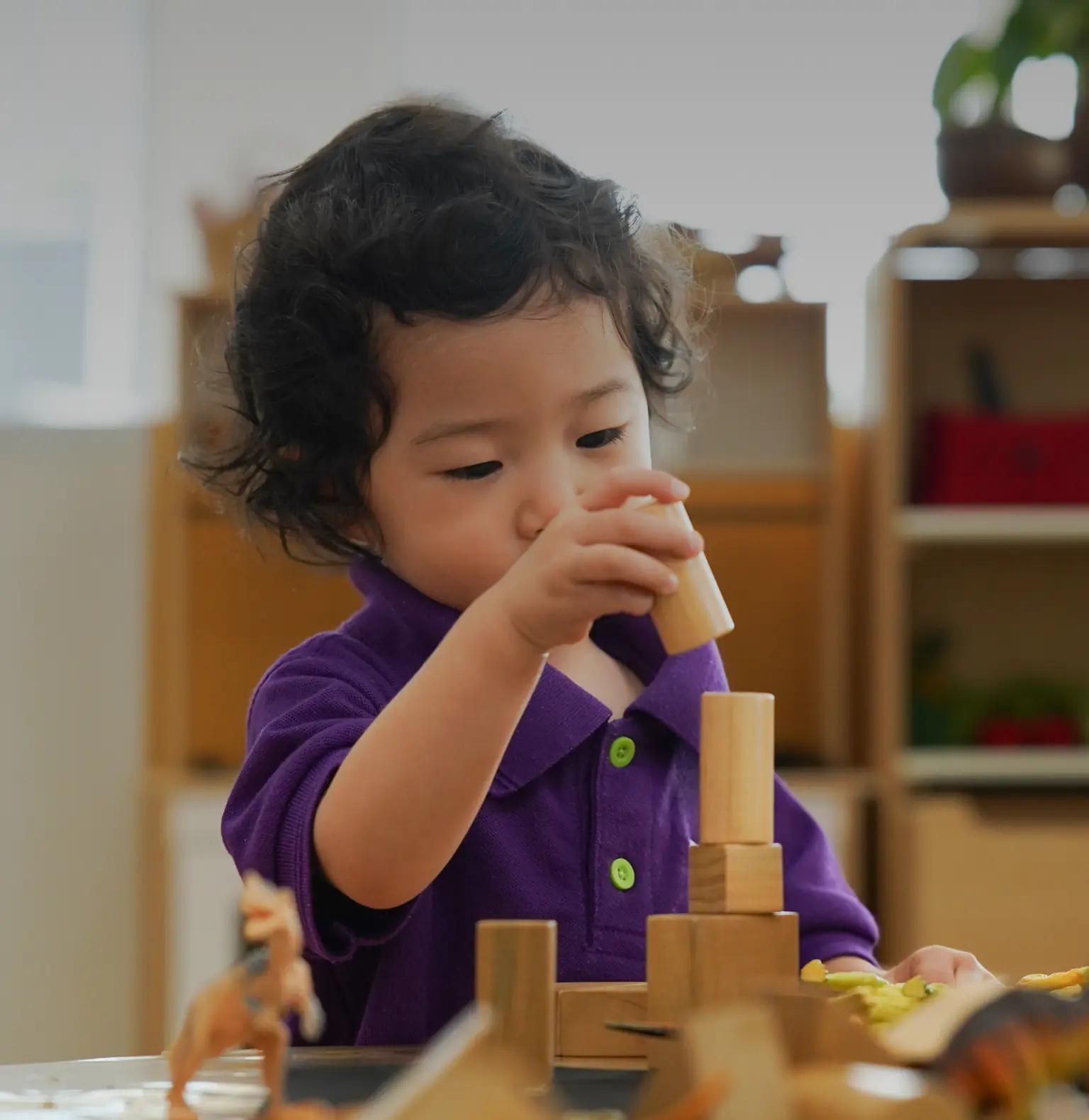 Children lined up for toy arranging activities at Sky Preschool